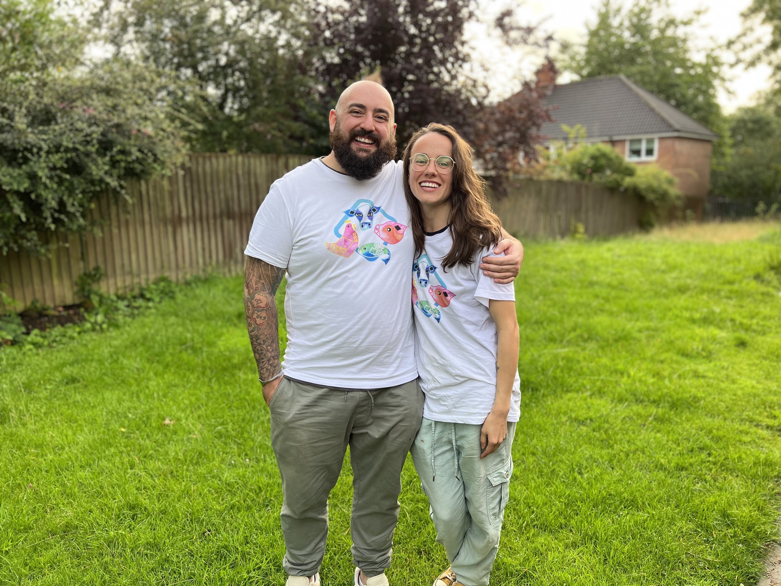 James Hattersley and his partner smiling together in a garden