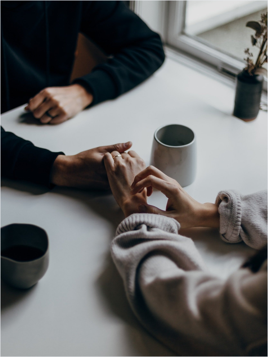 Two people holding hands