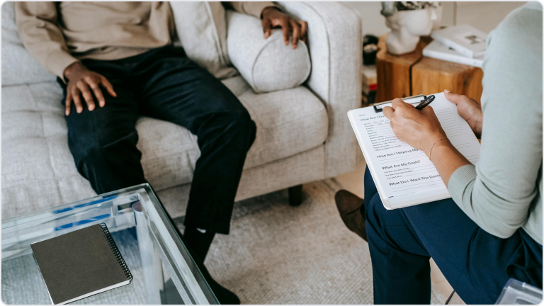 A therapist and a client sitting opposite each other